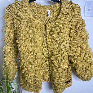 Sweater by Wish List. Gold with double knot heart